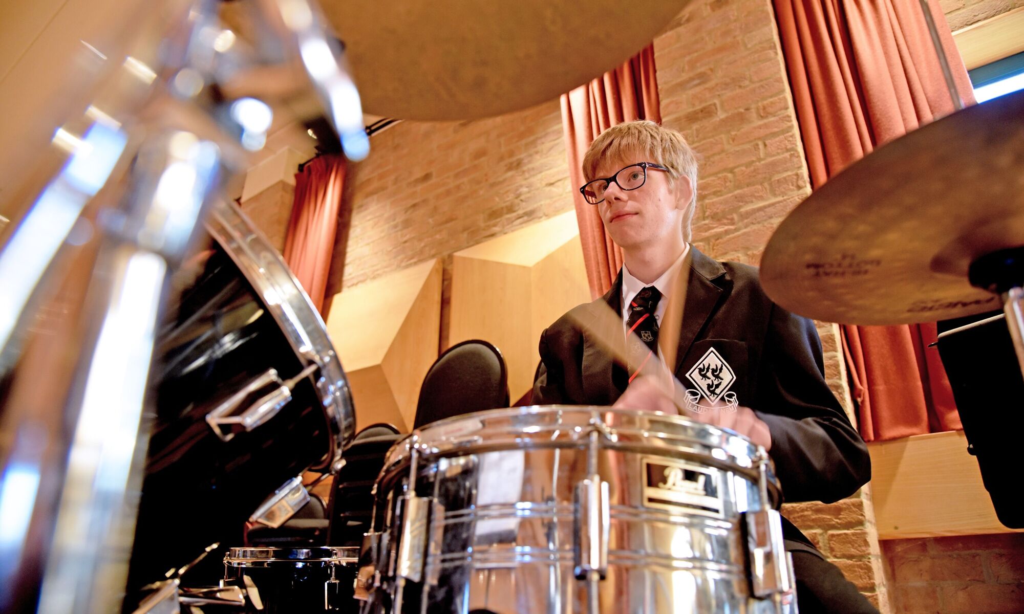 student playing drums